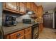 Functional kitchen layout with wooden cabinets and modern appliances at 5770 Dorsett Shoals Rd, Douglasville, GA 30135