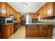 Charming kitchen with wood cabinets and stainless steel appliances at 5770 Dorsett Shoals Rd, Douglasville, GA 30135