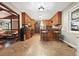 The kitchen features wooden cabinets, a breakfast bar, and an opening into the living room at 5770 Dorsett Shoals Rd, Douglasville, GA 30135