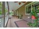 Spacious covered porch with ceiling fans and peaceful outdoor seating areas at 5770 Dorsett Shoals Rd, Douglasville, GA 30135