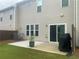 Grassy backyard featuring a concrete patio and well-kept lawn at 209 Ellis Ln, Woodstock, GA 30189