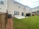 Well-maintained backyard features a concrete patio, perfect for outdoor entertaining at 209 Ellis Ln, Woodstock, GA 30189