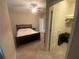Bedroom featuring a bed and door that leads to closet with shelving at 209 Ellis Ln, Woodstock, GA 30189