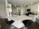 Modern kitchen with stainless steel appliances, quartz counters, and an island with seating at 209 Ellis Ln, Woodstock, GA 30189
