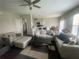 Open concept living room with comfortable furnishings and a large area rug at 209 Ellis Ln, Woodstock, GA 30189