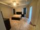 Comfortable bedroom features tray ceilings, neutral colors, and large windows at 209 Ellis Ln, Woodstock, GA 30189