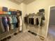 A closet with a long rack of clothing and accessories at 209 Ellis Ln, Woodstock, GA 30189