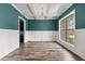 Elegant dining room with coffered ceiling, wainscoting, and large window at 7519 Waterview Cv, Douglasville, GA 30135