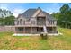 Stately brick home with a spacious deck overlooking the landscaped yard at 7519 Waterview Cv, Douglasville, GA 30135