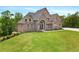Charming two-story brick home on a spacious lot with lush green lawn at 7519 Waterview Cv, Douglasville, GA 30135