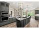 Gourmet kitchen featuring stainless steel appliances, gray cabinetry, and an open concept design at 7519 Waterview Cv, Douglasville, GA 30135