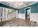 Stylish living space with coffered ceilings, modern lighting, and a staircase at 7519 Waterview Cv, Douglasville, GA 30135