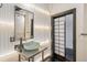 Contemporary bathroom featuring a vessel sink, modern vanity, and unique panel sliding door at 878 Ne Peachtree Ne St # 326, Atlanta, GA 30309