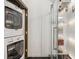 This bathroom contains an in-unit stacked washer and dryer, as well as a stand-up shower at 878 Ne Peachtree Ne St # 326, Atlanta, GA 30309