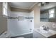 Bathroom featuring tile surround, a decorative inset, and stylish faucet at 6332 N Hampton N Dr, Atlanta, GA 30328