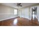 Cozy bedroom with hardwood floors, wainscoting, a ceiling fan, and a spacious closet at 6332 N Hampton N Dr, Atlanta, GA 30328