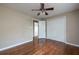 Bedroom features wood floors, ceiling fan, neutral paint, and closet at 6332 N Hampton N Dr, Atlanta, GA 30328