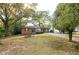 Traditional brick home with a lush front yard and a long driveway at 6332 N Hampton N Dr, Atlanta, GA 30328