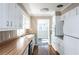 Functional kitchen with white cabinets, wood countertops, and modern appliances, providing plenty of storage space at 6332 N Hampton N Dr, Atlanta, GA 30328