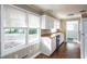 Bright kitchen featuring white cabinets, wood countertops, and a large window, allowing for plenty of natural light at 6332 N Hampton N Dr, Atlanta, GA 30328