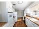 Functional kitchen with white cabinets, wood countertops, and modern appliances, offering a practical cooking space at 6332 N Hampton N Dr, Atlanta, GA 30328