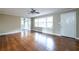 Spacious living room with gleaming hardwood floors, large windows, and neutral paint, offering a blank canvas to make your own at 6332 N Hampton N Dr, Atlanta, GA 30328