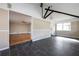 Open-concept living space featuring dark tile floors, neutral paint, and ample room for relaxing and entertaining at 6332 N Hampton N Dr, Atlanta, GA 30328