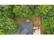 An aerial shot highlights the fenced backyard and mature trees surrounding this home at 6350 Summer Pl, Douglasville, GA 30135