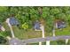 An aerial view shows the home surrounded by mature trees in a well-maintained neighborhood at 6350 Summer Pl, Douglasville, GA 30135