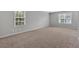 Bedroom with neutral paint and large windows at 6350 Summer Pl, Douglasville, GA 30135