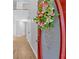 Inviting entryway featuring wood floors, neutral paint, and a decorative wreath on the front door at 6350 Summer Pl, Douglasville, GA 30135