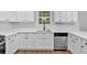 Bright kitchen featuring white cabinets, stainless steel appliances, and modern countertops at 6350 Summer Pl, Douglasville, GA 30135