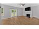 Spacious living room featuring a fireplace and French doors to the exterior at 6350 Summer Pl, Douglasville, GA 30135