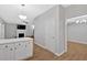 Open-concept view into living room from island featuring fireplace and TV at 6350 Summer Pl, Douglasville, GA 30135
