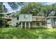 Backyard with a deck, patio, and mature trees, offering a private outdoor space at 1212 Eastridge Sw Rd, Atlanta, GA 30311