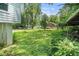 Large grassy backyard with lush greenery providing shade and a peaceful setting at 1212 Eastridge Sw Rd, Atlanta, GA 30311