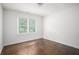 Bedroom featuring hardwood floors, white walls and natural light at 1212 Eastridge Sw Rd, Atlanta, GA 30311