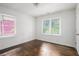 Bedroom featuring hardwood floors, white walls and natural light at 1212 Eastridge Sw Rd, Atlanta, GA 30311