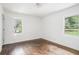 Bedroom featuring hardwood floors, white walls and natural light at 1212 Eastridge Sw Rd, Atlanta, GA 30311