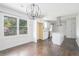 Bright kitchen features white cabinetry, granite countertops, stainless steel appliances and center island at 1212 Eastridge Sw Rd, Atlanta, GA 30311