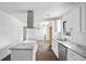 Bright kitchen features white cabinetry, granite countertops, stainless steel appliances and center island at 1212 Eastridge Sw Rd, Atlanta, GA 30311