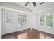 Sunroom has many windows, a door, and light hardwood floors at 1212 Eastridge Sw Rd, Atlanta, GA 30311