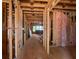 Framed interior showcasing the house's spacious layout, wooden beams, and potential for a customizable design at 2753 S Waterworks Rd, Buford, GA 30518