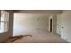 Spacious living room under construction, featuring ample natural light and open layout at 2753 S Waterworks Rd, Buford, GA 30518