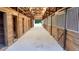 Bright barn with many horse stalls along a center hallway at 3011 Flat Shoals Sw Rd, Conyers, GA 30094