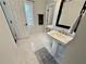 Elegant bathroom featuring double sinks, sleek fixtures, and neutral decor with a luxurious feel at 3011 Flat Shoals Sw Rd, Conyers, GA 30094
