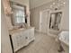 Bathroom with vanity, elegant lighting, and decorative mirrors at 3011 Flat Shoals Sw Rd, Conyers, GA 30094