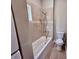 Clean bathroom featuring tiled shower and tub with new fixtures and modern toilet at 3011 Flat Shoals Sw Rd, Conyers, GA 30094