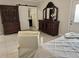 Bedroom view of large furniture and decor plus a barn door leading to the Primary bath at 3011 Flat Shoals Sw Rd, Conyers, GA 30094