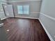 Spacious dining area featuring new wood flooring, fresh paint, and natural light at 3011 Flat Shoals Sw Rd, Conyers, GA 30094